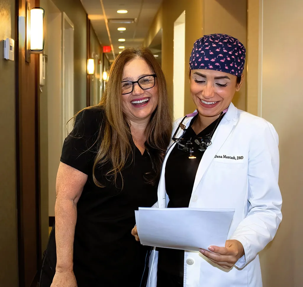 Dentists laughing together having a good time with good vibes